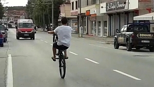 BİSİKLET ÜZERİNDE TEHLİKELİ YOLCULUK